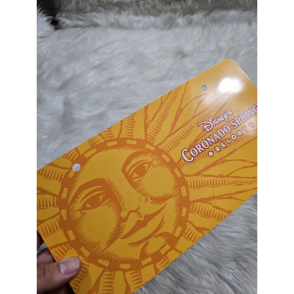 Vintage Disney Coronado Springs Resort Plastic License Plate Yellow Sun